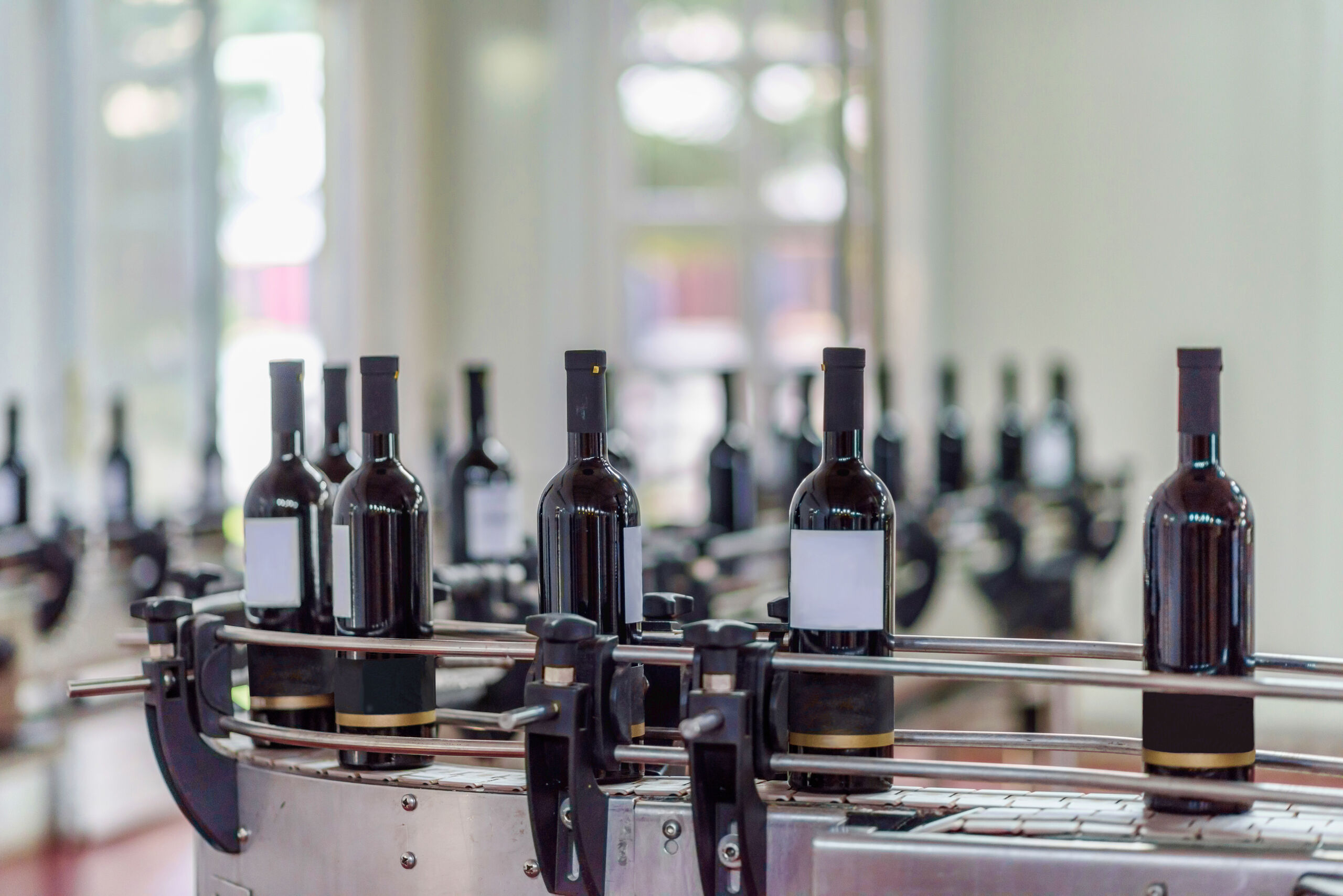 Bottles of wine in the process of RFID-labeled